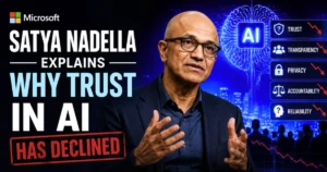 Microsoft CEO Satya Nadella speaking beside an AI-themed graphic with declining trust indicators, illustrating his comments on why public trust in artificial intelligence has fallen.