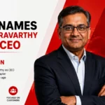 Adobe appoints Anil Chakravarthy as CEO, featuring his portrait with the Adobe logo and AI technology graphics.
